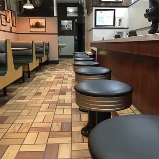 a row of stools in a restaurant