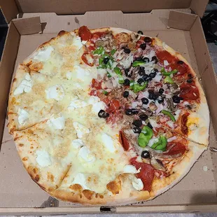 Half White pizza with extra garlic, half Supreme. Both sides excellent!