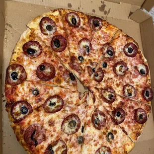 Skimpy pizza with barely any cheese or olives