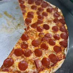 half of a pepperoni pizza