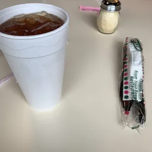 My customized Arnold Palmer tea with lemonade and my packet of sealed plastic flatware.