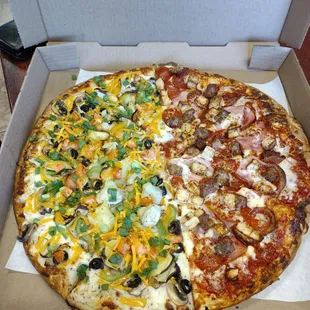 XL Pizza  half artichoke fiesta with white sauce the other half is the meat lovers with extra chicken added