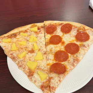 two slices of pepperoni and pineapple pizza