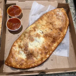 Large Meat Lovers Stromboli. Came with 2 Marinaras!