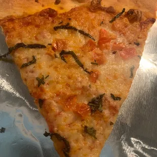 This is what a slice of Margherita pizza looks like? Pretty sad...where are the tomato slices? The basil?