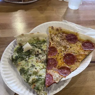 Chicken Pesto and Pepperoni.  In the background:  Hawaiian and 3-Meat pizza