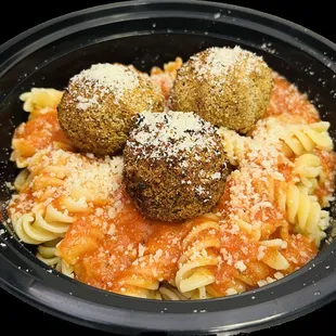 a bowl of pasta and meatballs