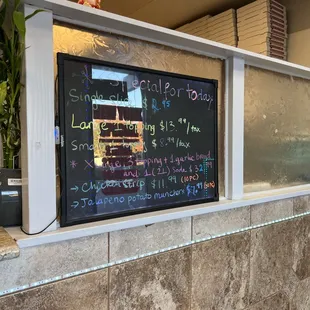 a chalkboard menu on the counter