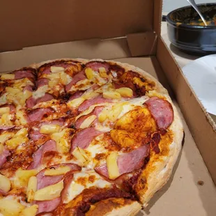 a pizza in a pizza box