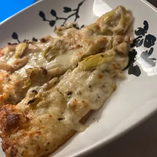 a slice of pizza on a plate