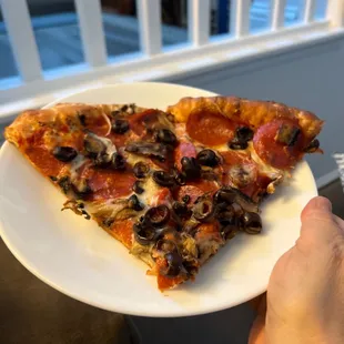 2 slices of medium pizza. Good crispy crust!