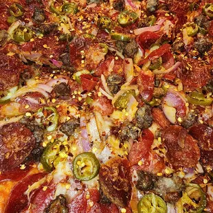 pepperoni, jalapenos, and other toppings