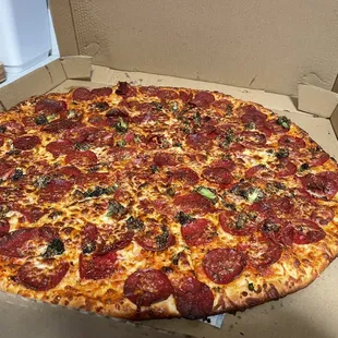 a pepperoni pizza in a box