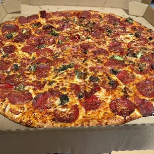 a pepperoni pizza in a box