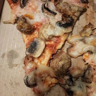 two slices of pizza in a box