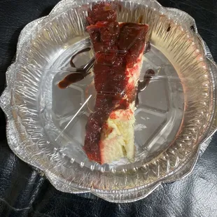 $6 super thin slice of cheesecake smothered in strawberries that were not part of menu description.