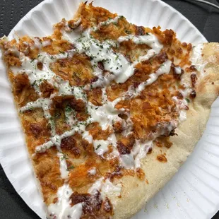 a slice of pizza on a paper plate