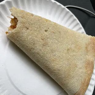 a piece of pizza on a paper plate