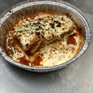 Homemade lasagna with ricotta cheese and beef so good you&apos;ll always catch the bill by the horns.