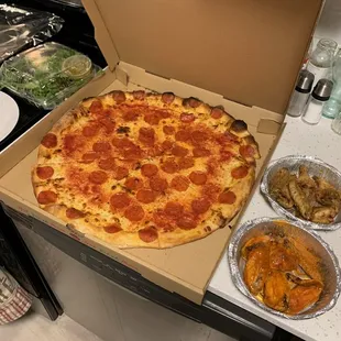 Large pepperoni pizza, side salad with house dressing, 6 Buffalo wings and 6 Pineapple Habanero (not for the timid)...