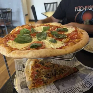 Margherita pizza and PMS slice of the day.  Pepperoni, mushroom and sausage.