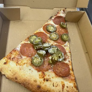 Jalapeño extra pepperoni pizza slice