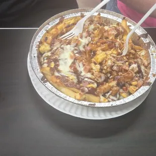 Barbecue fries with chicken and cheese.