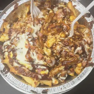 Barbecue fries with chicken and cheese.