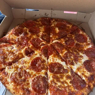 a pepperoni pizza in a box