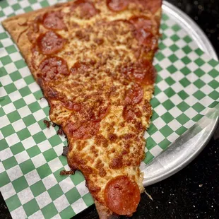a slice of pepperoni pizza
