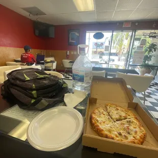 Tuscan Pizza and owner watching a movie on his laptop...
