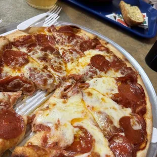 Medium pepperoni pizza and spaghetti with meat sauce