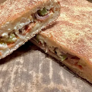 10" calzone filled with mozzarella cheese and ricotta. Added mushrooms, pepperoni, bell peppers and onions for $1.50 each.