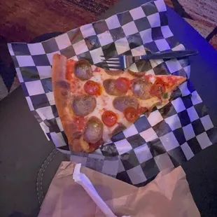 a slice of pepperoni pizza