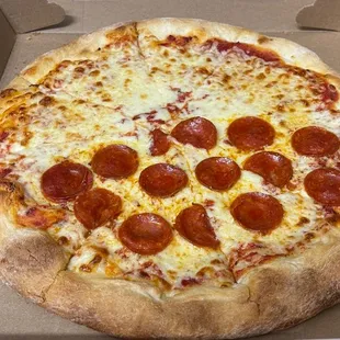 a pepperoni pizza in a box