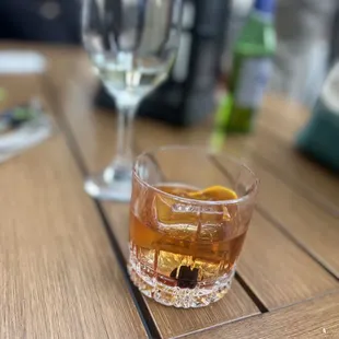 a glass of whiskey on a table