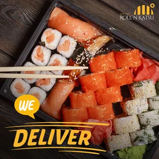 a tray of sushi with chopsticks