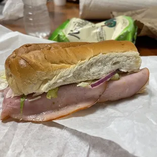 a sandwich with meat and vegetables