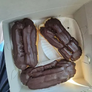 Three huge chocolate chocolate eclaires