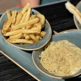 three bowls of food on a tray