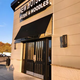 Door and signage faces NW corner of parking lot so it is hard to see from the road