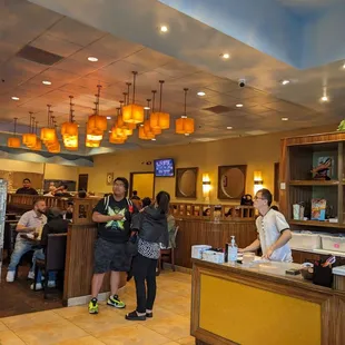 customers at the counter of a restaurant