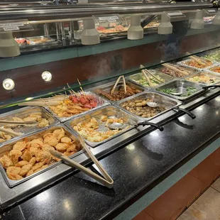 a variety of food in a buffet
