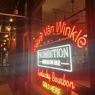 a neon sign in a window