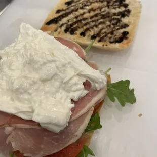 Prosciutto Burrata on Toasted Ciabatta: balsamic glaze, arugula, tomatoes, prosciutto &amp; burrata cheese