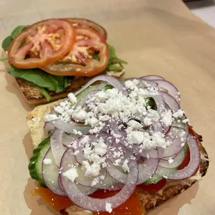 Veggie Mediterranean on Toasted Ciabatta: roasted garlic hummus, spinach, tomatoes, red onions, feta cheese, cucumbers &amp; roasted red peppers