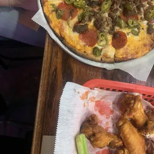 buffalo wings and pepperoni, sausage, jalapeño pizza