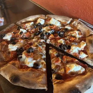 a pizza with a slice taken out of it