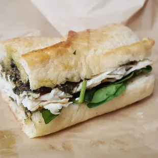 Delicious, yummy, Panini Sandwhich, Turkey, cheese, black olives and spinach.