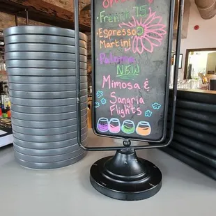 a drink menu on a chalkboard